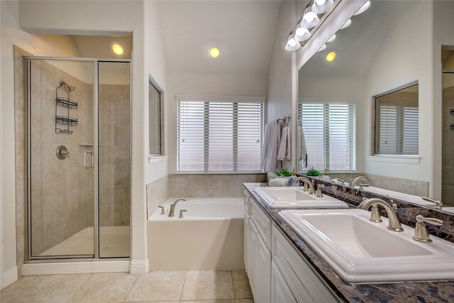 1328 Sandpiper Dr, Forney, TX 75126 - full bathroom with double vanity, a garden tub, a shower stall, tile patterned flooring, and lofted ceiling
