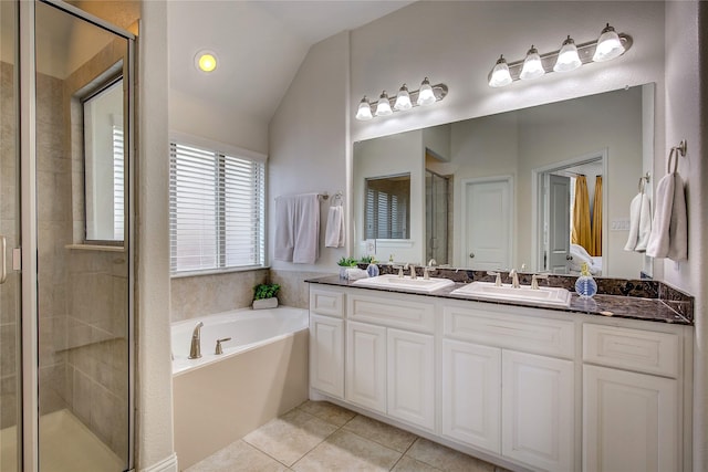 1328 Sandpiper Dr, Forney, TX 75126 - full bathroom with double vanity, a bath, a stall shower, lofted ceiling, and tile patterned flooring