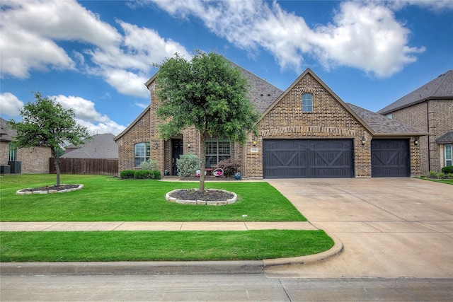1328 Sandpiper Dr, Forney, TX 75126 - view of front of property featuring brick siding, concrete driveway, and a garage