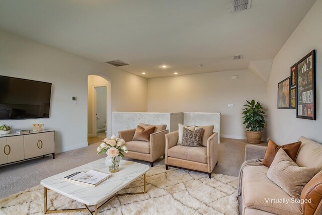 1328 Sandpiper Dr, Forney, TX 75126 - carpeted living area featuring arched walkways, baseboards, and recessed lighting