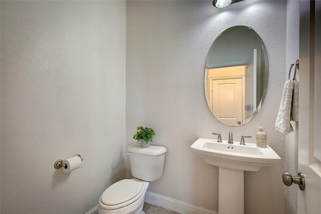 1328 Sandpiper Dr, Forney, TX 75126 - bathroom featuring toilet and baseboards