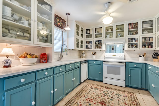 1467 Limerick Ct, Keller, TX 76262 - kitchen with electric range, a sink, dishwasher, light tile patterned floors, and light countertops