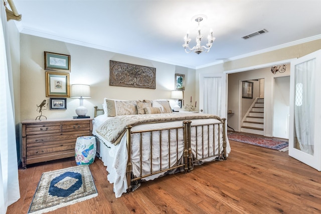 1467 Limerick Ct, Keller, TX 76262 - bedroom featuring wood finished floors, ornamental molding, and a chandelier