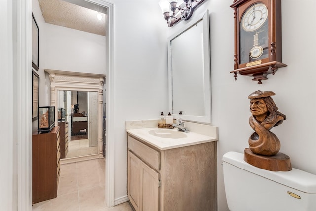 1467 Limerick Ct, Keller, TX 76262 - bathroom with toilet, vanity, tile patterned floors, and a textured ceiling