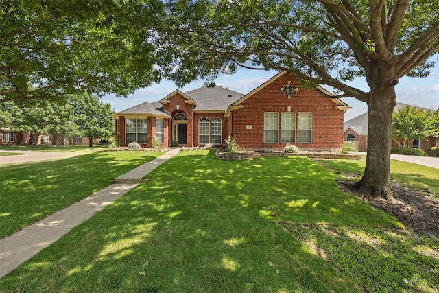 712 Saint Robby Dr, Mansfield, TX 76063 - view of front facade with brick siding and a front yard