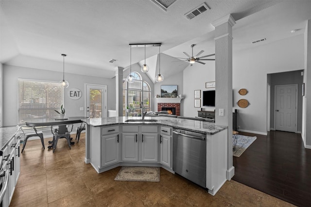 712 Saint Robby Dr, Mansfield, TX 76063 - kitchen with stainless steel dishwasher, a sink, decorative columns, lofted ceiling, and ceiling fan