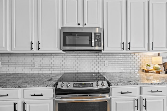712 Saint Robby Dr, Mansfield, TX 76063 - kitchen with stainless steel appliances, white cabinetry, and backsplash