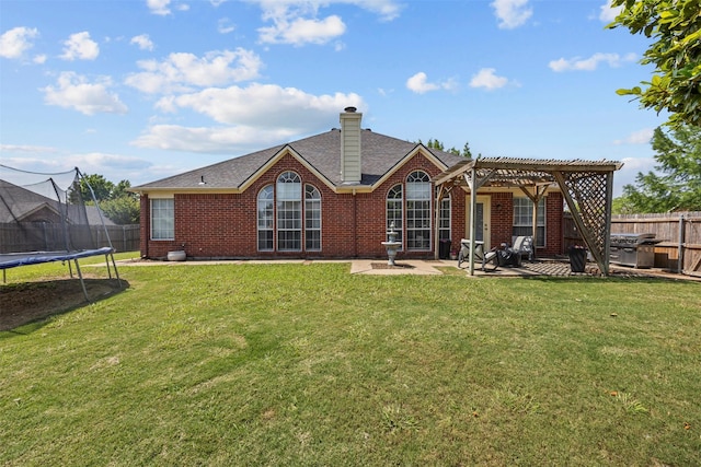 712 Saint Robby Dr, Mansfield, TX 76063 - back of property with a trampoline, a pergola, brick siding, a patio, and a chimney