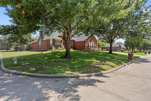 712 Saint Robby Dr, Mansfield, TX 76063 - view of front of property featuring brick siding, a front lawn, a chimney, and a residential view