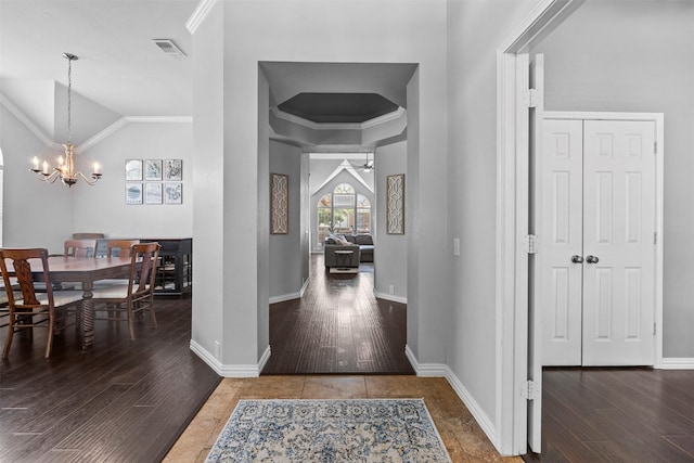 712 Saint Robby Dr, Mansfield, TX 76063 - entryway with a chandelier, wood finished floors, ornamental molding, lofted ceiling, and baseboards
