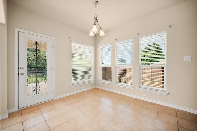 700 Sage Brush Dr, Weatherford, TX 76087 - unfurnished dining area featuring healthy amount of natural light, baseboards, and a chandelier