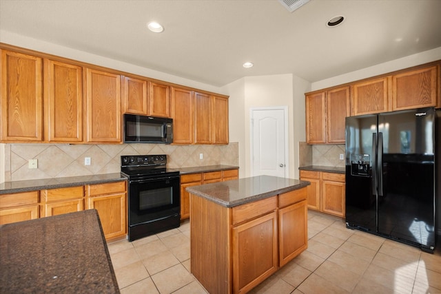 700 Sage Brush Dr, Weatherford, TX 76087 - kitchen with black appliances, backsplash, light tile patterned floors, dark stone counters, and brown cabinetry
