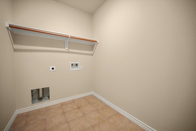 700 Sage Brush Dr, Weatherford, TX 76087 - washroom featuring washer hookup, hookup for an electric dryer, baseboards, and tile patterned flooring