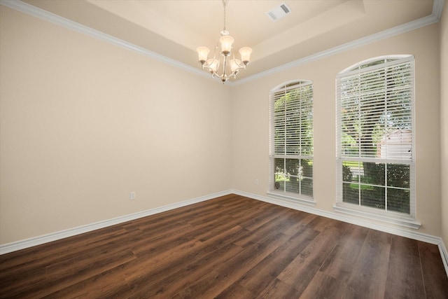 700 Sage Brush Dr, Weatherford, TX 76087 - empty room with a chandelier, a tray ceiling, dark wood-style floors, crown molding, and baseboards