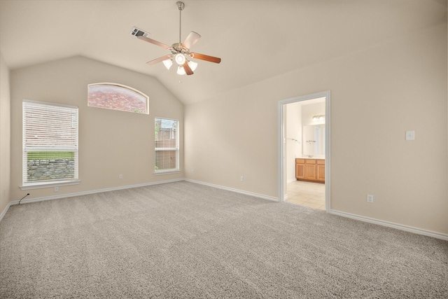 700 Sage Brush Dr, Weatherford, TX 76087 - spare room featuring light carpet, ceiling fan, lofted ceiling, and baseboards
