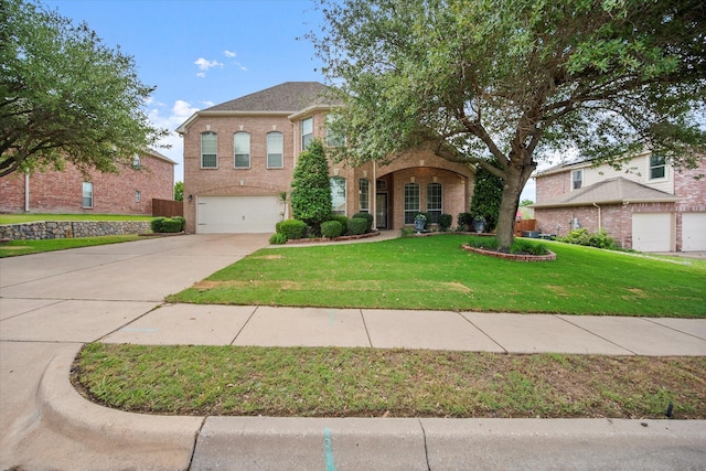 700 Sage Brush Dr, Weatherford, TX 76087 - view of front facade with an attached garage, driveway, a front lawn, and brick siding