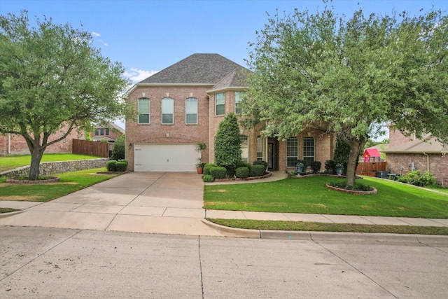 700 Sage Brush Dr, Weatherford, TX 76087 - view of front facade featuring a garage, concrete driveway, and brick siding