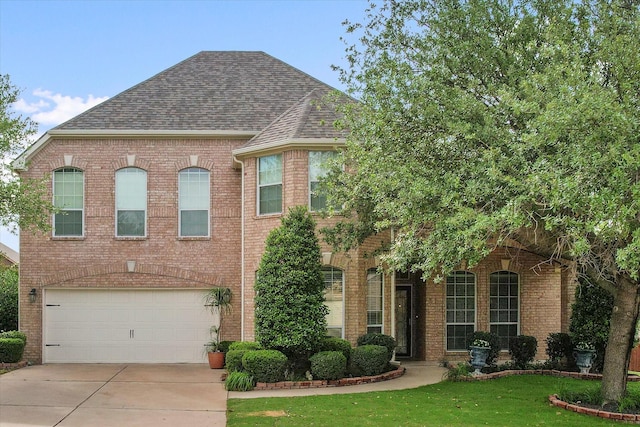700 Sage Brush Dr, Weatherford, TX 76087 - view of front facade with brick siding, a shingled roof, and an attached garage
