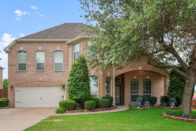 700 Sage Brush Dr, Weatherford, TX 76087 - view of front facade featuring brick siding, concrete driveway, a front yard, and an attached garage