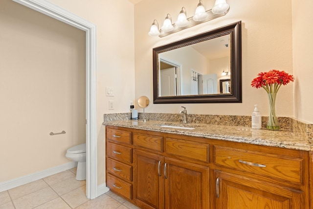 706 E 1st St, Fort Worth, TX 76102 - bathroom featuring tile patterned floors, vanity, toilet, and baseboards