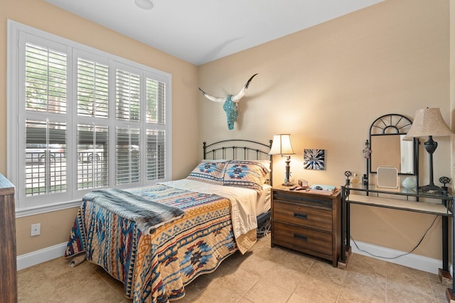 706 E 1st St, Fort Worth, TX 76102 - bedroom featuring baseboards and tile patterned floors
