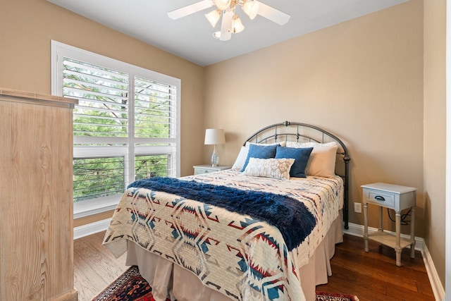706 E 1st St, Fort Worth, TX 76102 - bedroom with wood finished floors, baseboards, and a ceiling fan