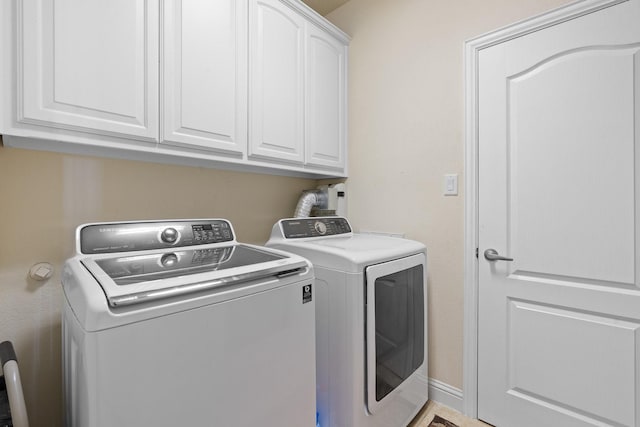 706 E 1st St, Fort Worth, TX 76102 - washroom with cabinet space and independent washer and dryer