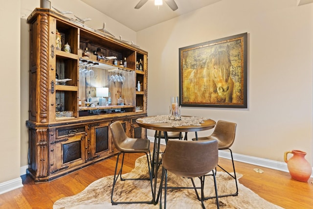 706 E 1st St, Fort Worth, TX 76102 - dining space with wood finished floors, baseboards, and a ceiling fan