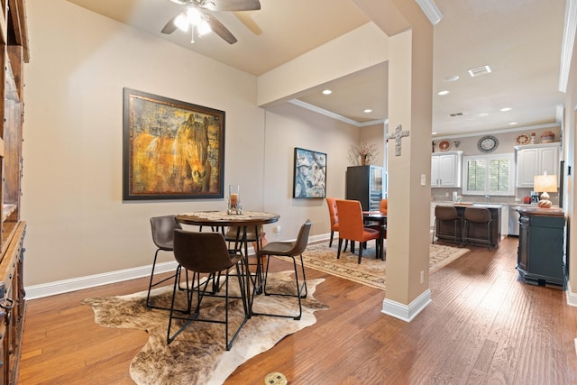 706 E 1st St, Fort Worth, TX 76102 - dining area featuring wood finished floors, ceiling fan, baseboards, ornamental molding, and recessed lighting