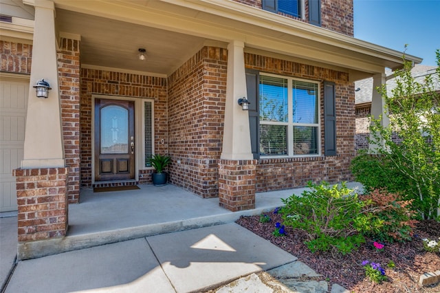 11812 Patton Dr, Frisco, TX 75036 - doorway to property with brick siding and a porch