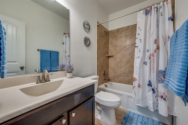 11812 Patton Dr, Frisco, TX 75036 - full bath with toilet, vanity, shower / bath combo with shower curtain, a textured wall, and tile patterned floors