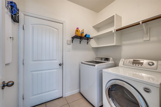 11812 Patton Dr, Frisco, TX 75036 - laundry area featuring separate washer and dryer and light tile patterned floors