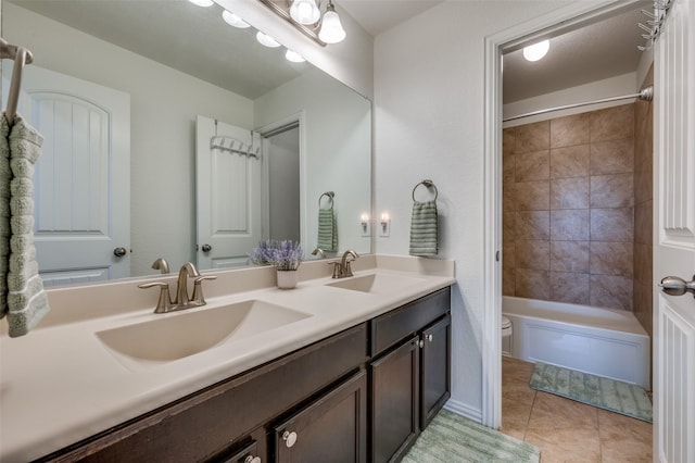 11812 Patton Dr, Frisco, TX 75036 - full bathroom with double vanity, toilet, tile patterned flooring, and  shower combination