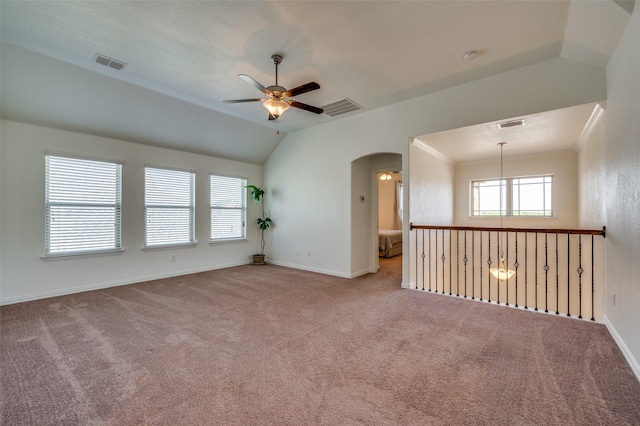 11812 Patton Dr, Frisco, TX 75036 - carpeted empty room with a ceiling fan, arched walkways, baseboards, and lofted ceiling