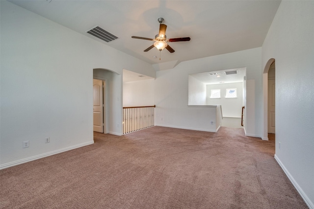 11812 Patton Dr, Frisco, TX 75036 - carpeted spare room featuring arched walkways, a ceiling fan, and baseboards