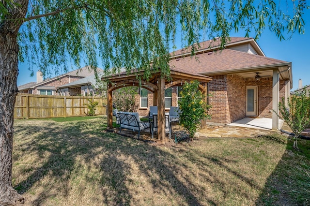 11812 Patton Dr, Frisco, TX 75036 - rear view of house featuring brick siding, a shingled roof, a patio area, and a gazebo