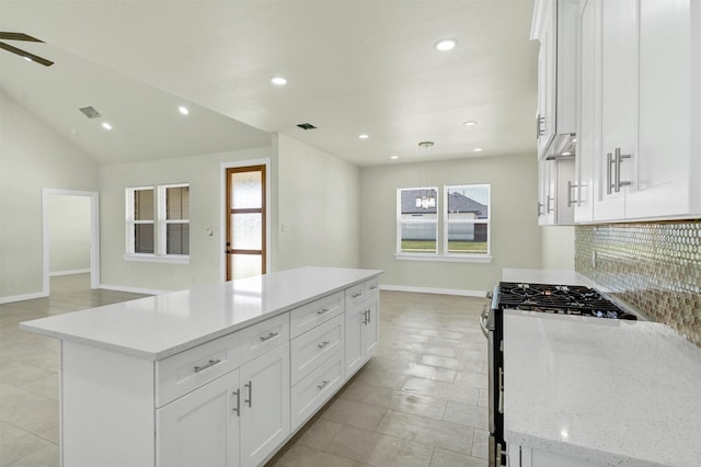 548 Highview Ct, Godley, TX 76044 - kitchen featuring baseboards, a kitchen island, plenty of natural light, stainless steel gas stove, and recessed lighting