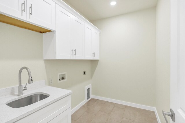 548 Highview Ct, Godley, TX 76044 - laundry room with cabinet space, hookup for an electric dryer, hookup for a washing machine, recessed lighting, and light tile patterned flooring