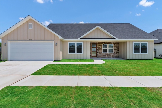 548 Highview Ct, Godley, TX 76044 - view of front of house with board and batten siding, roof with shingles, a garage, driveway, and a front yard