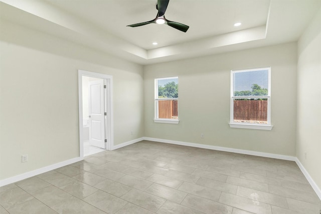 548 Highview Ct, Godley, TX 76044 - empty room featuring a tray ceiling, a ceiling fan, recessed lighting, baseboards, and light tile patterned floors