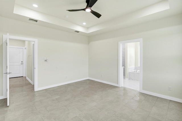 548 Highview Ct, Godley, TX 76044 - empty room featuring a tray ceiling, ceiling fan, baseboards, and recessed lighting