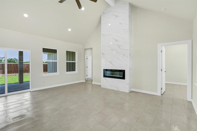 548 Highview Ct, Godley, TX 76044 - unfurnished living room with high vaulted ceiling, a ceiling fan, baseboards, a premium fireplace, and recessed lighting