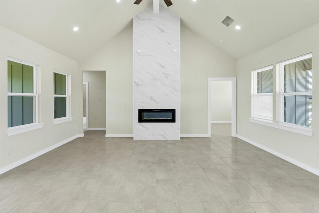 548 Highview Ct, Godley, TX 76044 - unfurnished living room with high vaulted ceiling, a premium fireplace, ceiling fan, baseboards, and recessed lighting