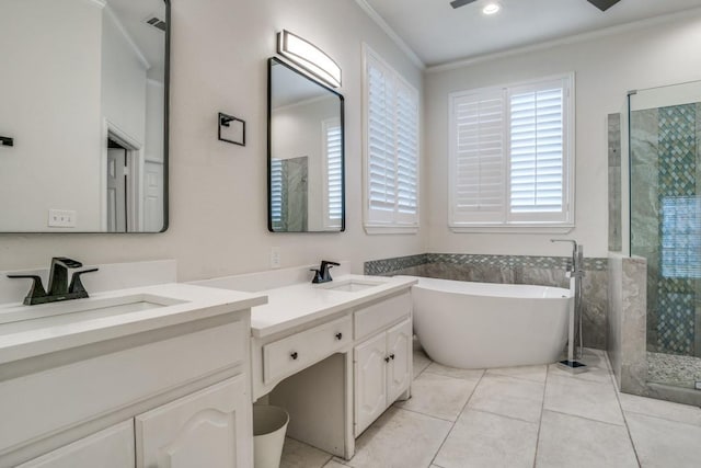 6637 Oakmont Ct, Plano, TX 75093 - full bathroom featuring plenty of natural light, ornamental molding, a stall shower, double vanity, and a soaking tub