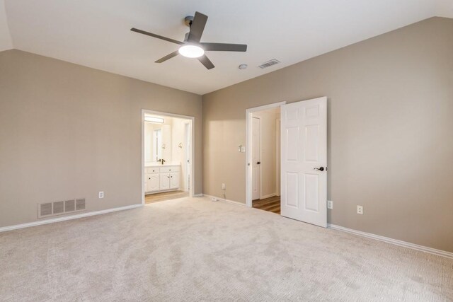 6637 Oakmont Ct, Plano, TX 75093 - unfurnished bedroom with carpet floors, baseboards, lofted ceiling, connected bathroom, and ceiling fan