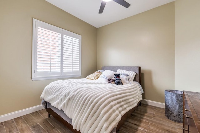 6637 Oakmont Ct, Plano, TX 75093 - bedroom featuring baseboards, wood finished floors, and a ceiling fan