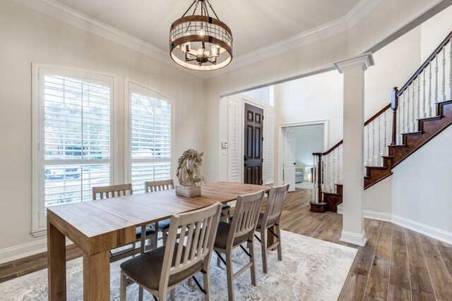 6637 Oakmont Ct, Plano, TX 75093 - dining room with a chandelier, healthy amount of natural light, stairs, baseboards, and crown molding