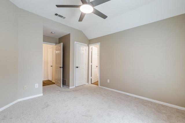6637 Oakmont Ct, Plano, TX 75093 - unfurnished bedroom with light carpet, baseboards, lofted ceiling, ceiling fan, and connected bathroom