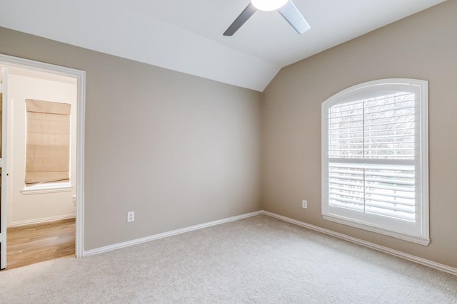 6637 Oakmont Ct, Plano, TX 75093 - carpeted empty room featuring a ceiling fan, plenty of natural light, lofted ceiling, and baseboards