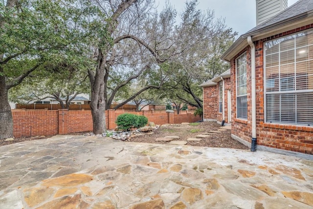 6637 Oakmont Ct, Plano, TX 75093 - fenced backyard with a patio area